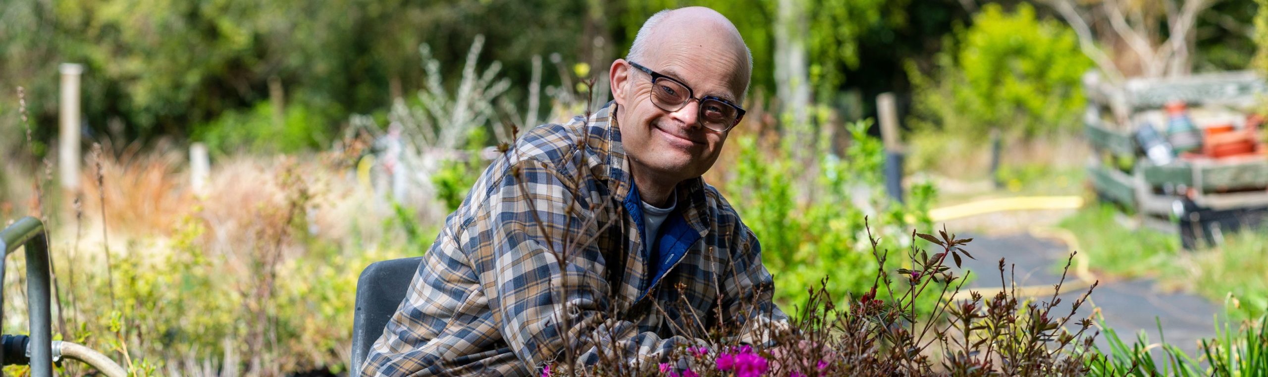 Gardeners with learning disabilities working in cottage garden